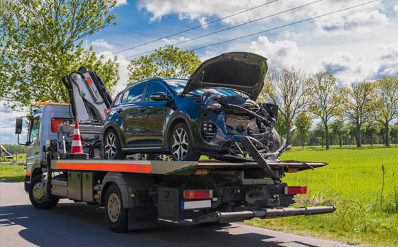 Truck Towing Car — Towing Services in Mid North Coast